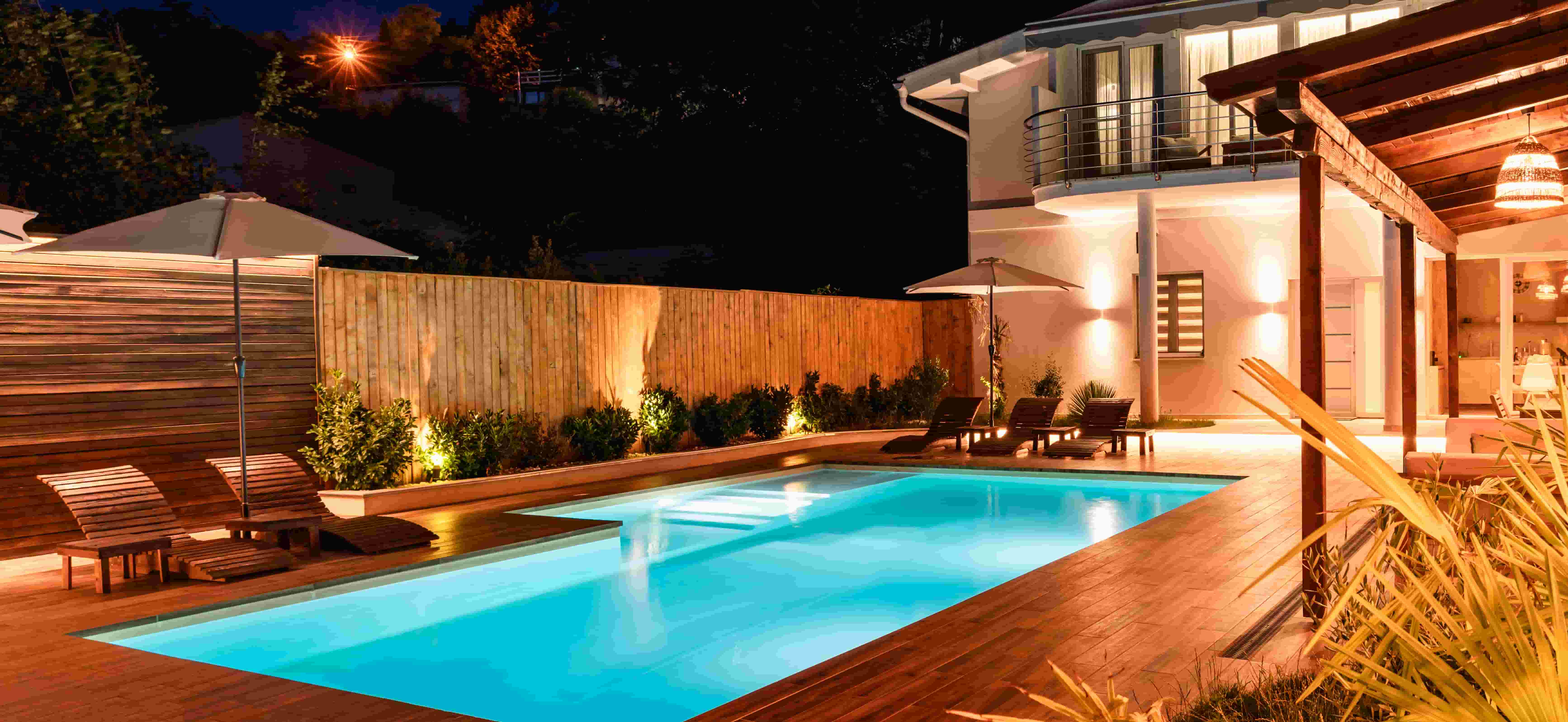 luxury-backyard-with-illuminated-swimming-pool-modern-house-elegant-outdoor-space-featuring.jpg